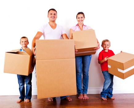 Student removals team loading boxes in a Haringey street