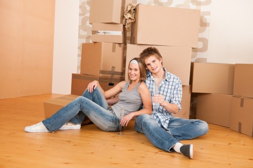 Household movers handling stairs and furniture in a Haringey flat