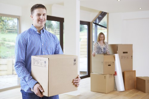 Packed office furniture and IT items ready for relocation