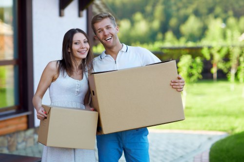 Removal truck handling boxes and furniture in North London