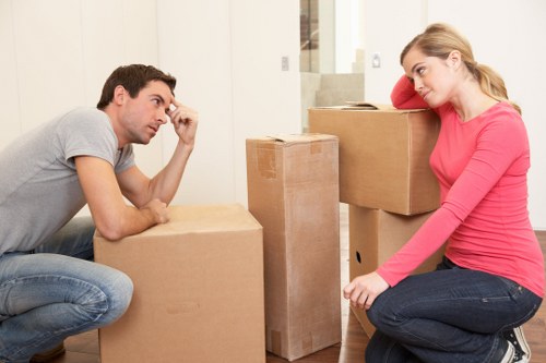 Packed office furniture and boxes ready for a local business move