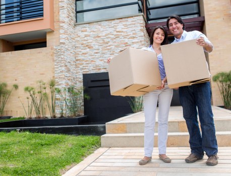 Professional movers carrying furniture during a house removal in Haringey